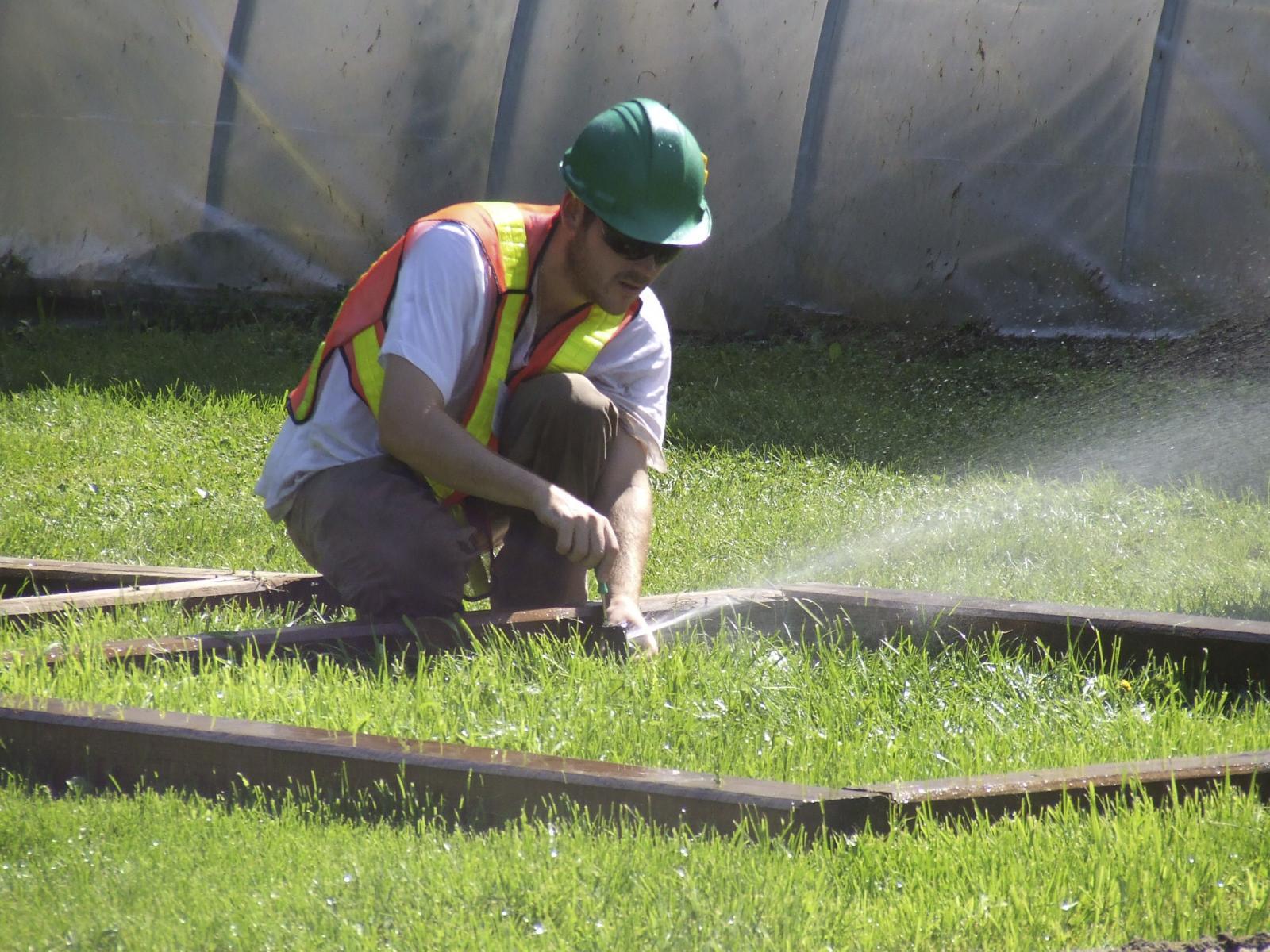 Certified worker testing a sprinkler system